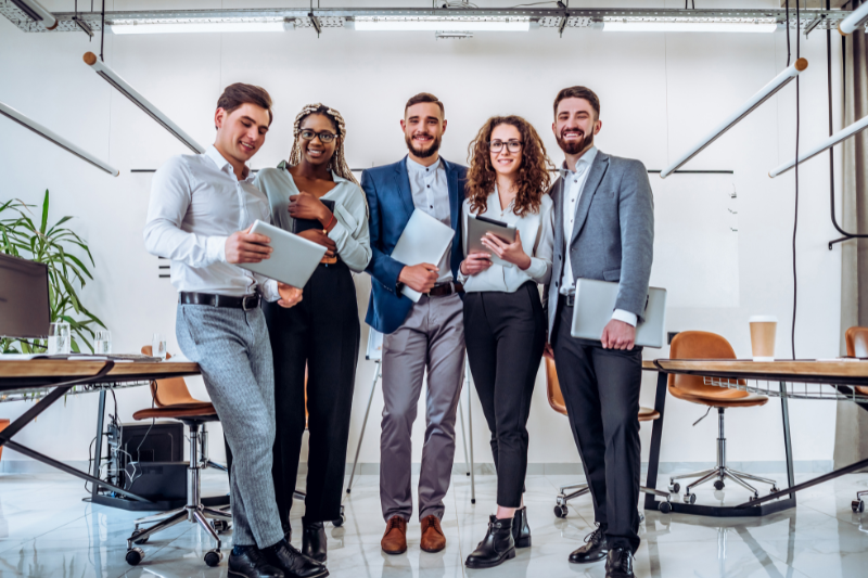 Team of RAKEZ Approved Auditors in Dubai | RVG standing confidently in a modern office