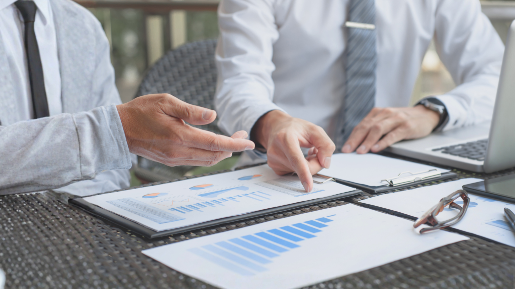 Due diligence services in Dubai with professionals reviewing financial reports and data