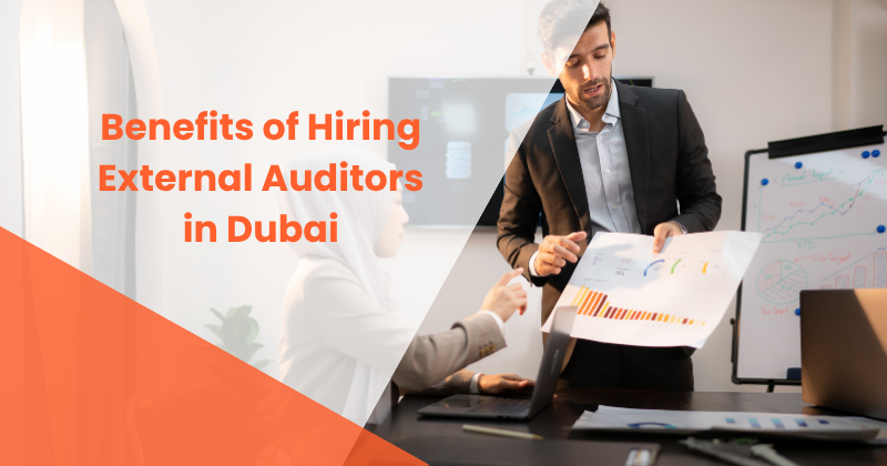 Professional external auditors in Dubai reviewing financial reports and compliance documents for business growth and UAE regulatory compliance